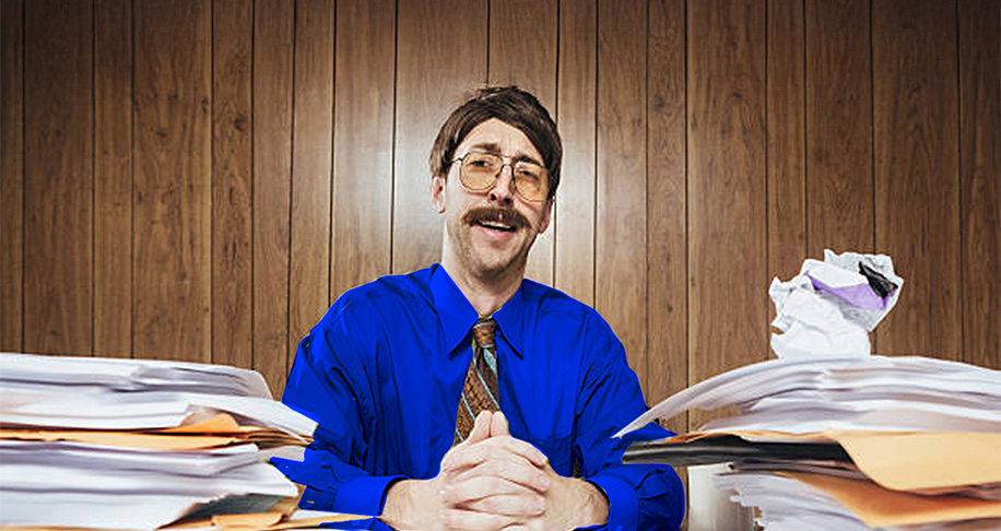 A person wearing glass sitting in office desk