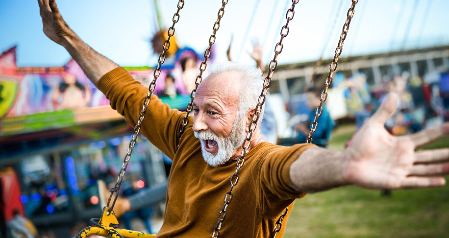 Man on swing at fair